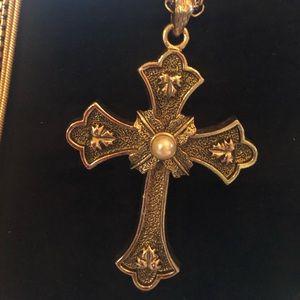 Gold tone cross necklace.